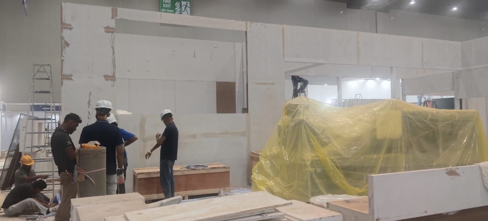 Booth framework under construction on the show floor