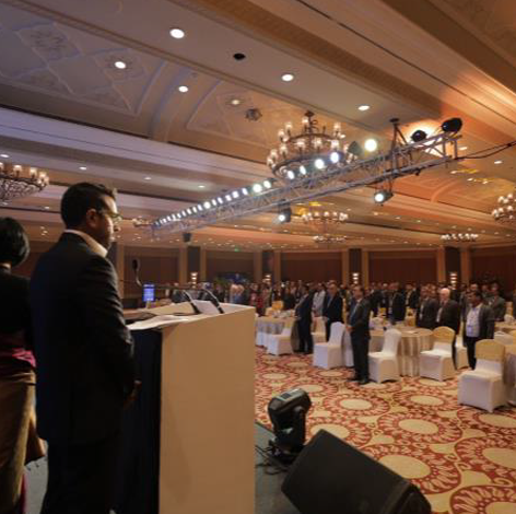 Corporate event branding across stage, signage and venue