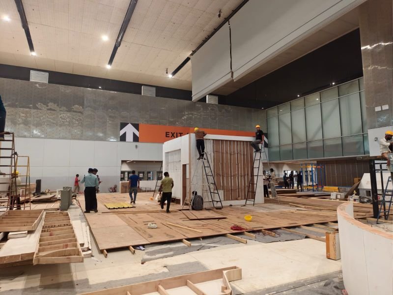 ChalkWalk install crew building a booth framework on-site