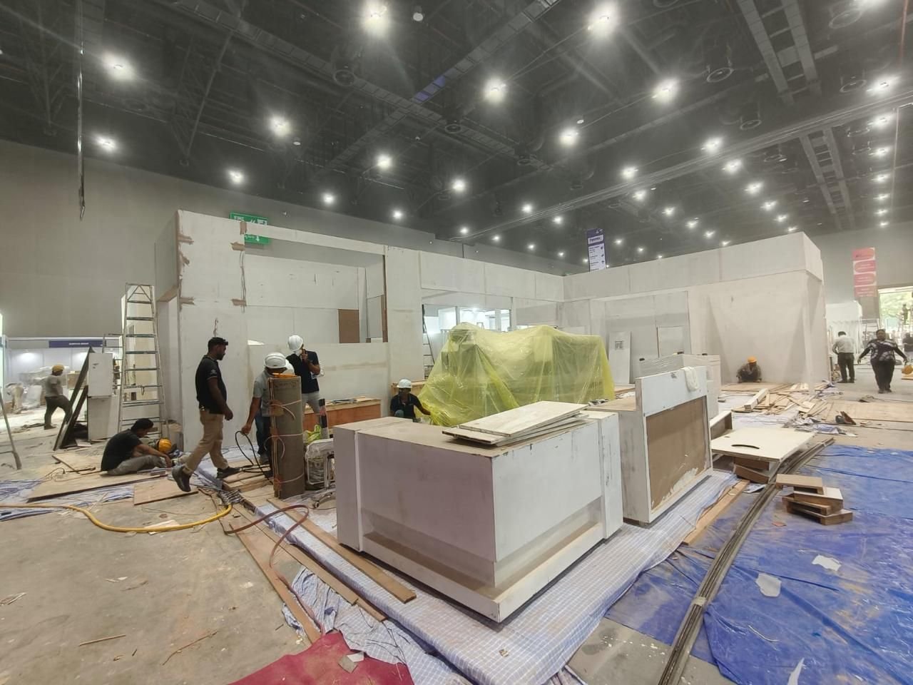 Exhibition stall installation crew at work on-site