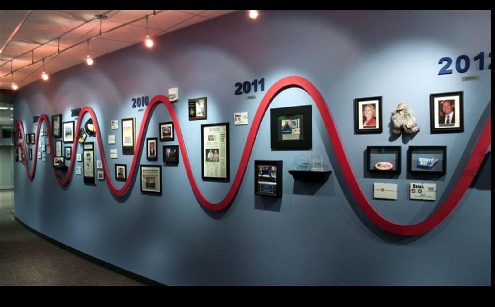 Corporate honor wall and history display installation